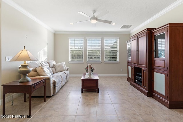 living room with crown molding, light tile patterned flooring, and ceiling fan