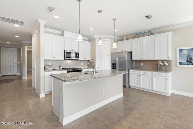 kitchen featuring white cabinets, sink, an island with sink, and appliances with stainless steel finishes