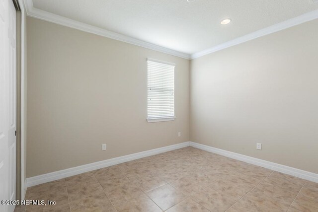 unfurnished room featuring ornamental molding