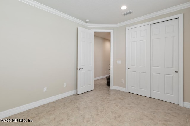 unfurnished bedroom featuring a closet and ornamental molding