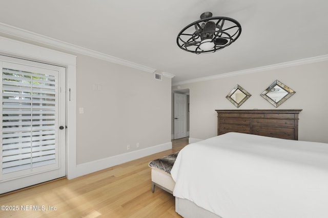 bedroom with wood-type flooring, ornamental molding, and access to outside