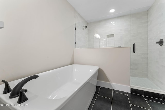 bathroom featuring tile patterned flooring and shower with separate bathtub