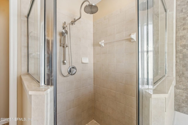 bathroom featuring an enclosed shower