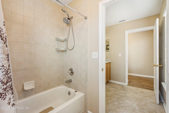 bathroom with vanity and shower / bathtub combination with curtain