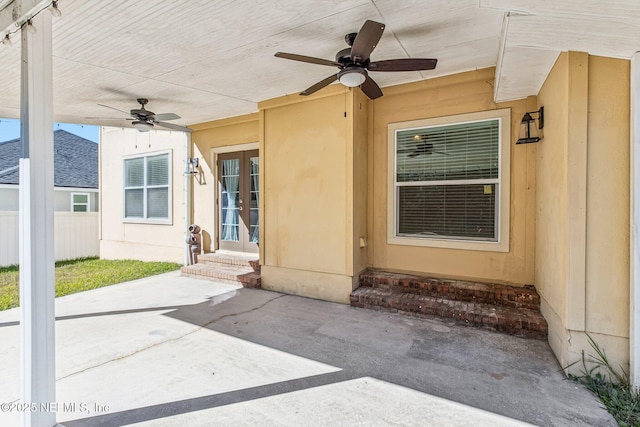 property entrance featuring a patio and ceiling fan