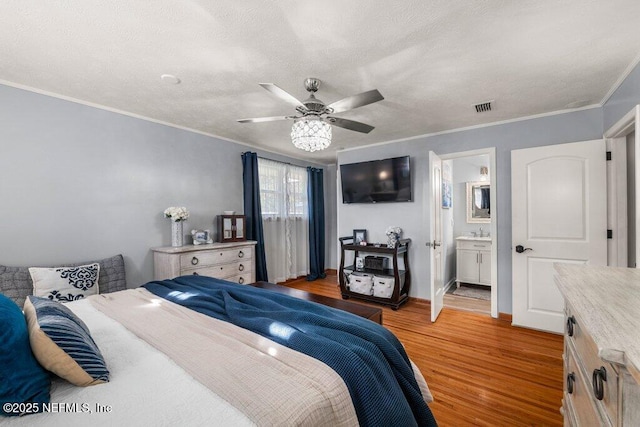 bedroom with sink, ensuite bath, ceiling fan, ornamental molding, and light hardwood / wood-style floors