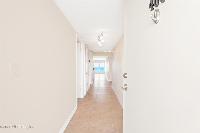 hallway with light tile patterned floors