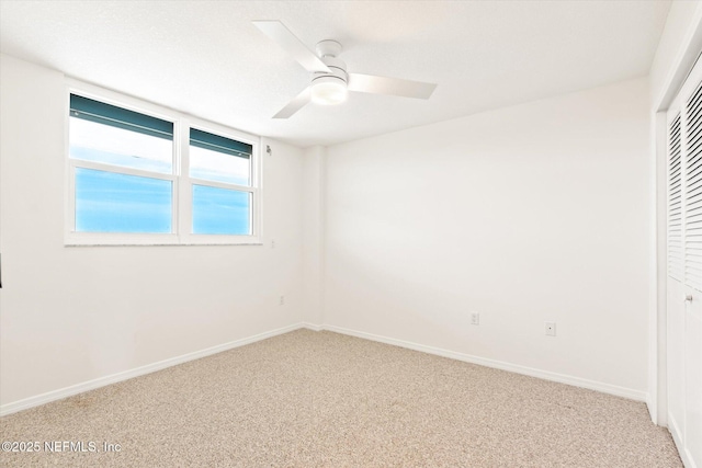 interior space with ceiling fan