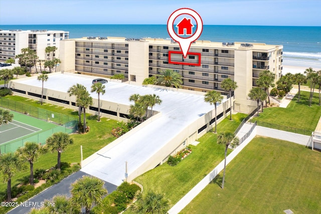 drone / aerial view featuring a view of the beach and a water view