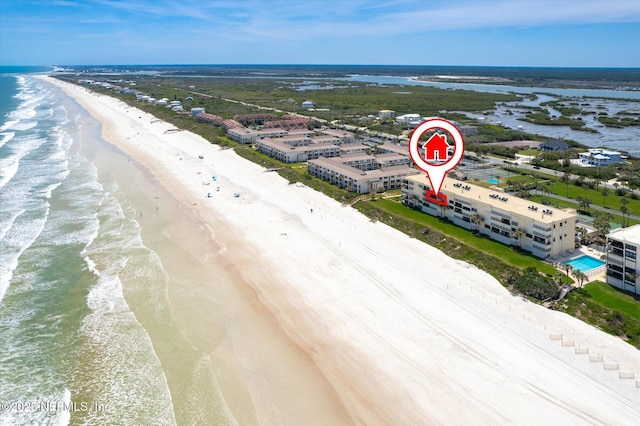 aerial view featuring a water view and a beach view