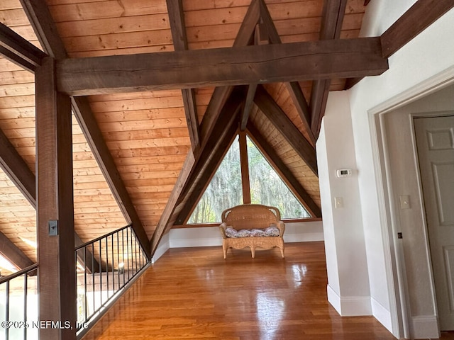 bonus room with hardwood / wood-style floors, vaulted ceiling with beams, and wooden ceiling