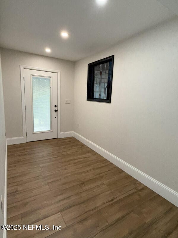 doorway to outside featuring dark hardwood / wood-style floors