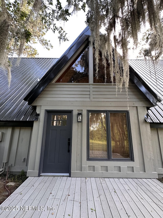 doorway to property featuring a wooden deck