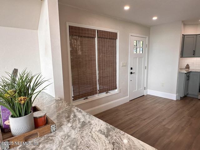 foyer entrance with dark hardwood / wood-style floors