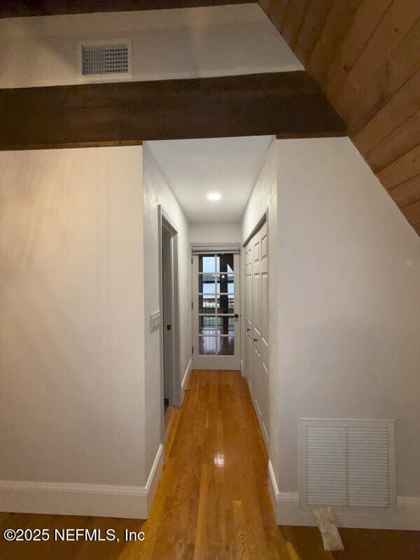 hall with hardwood / wood-style flooring