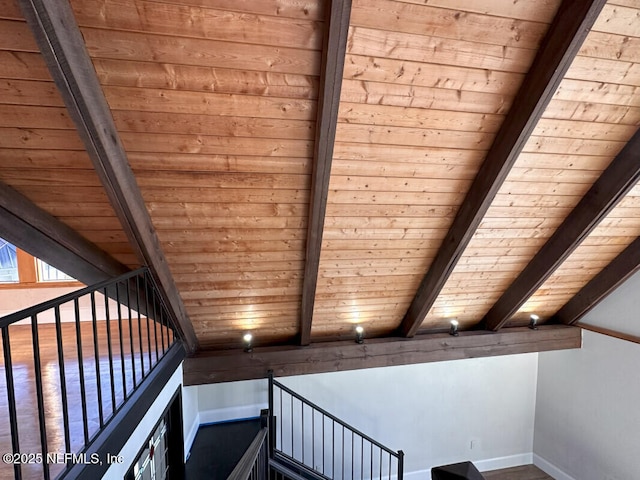 stairway with lofted ceiling with beams and wooden ceiling