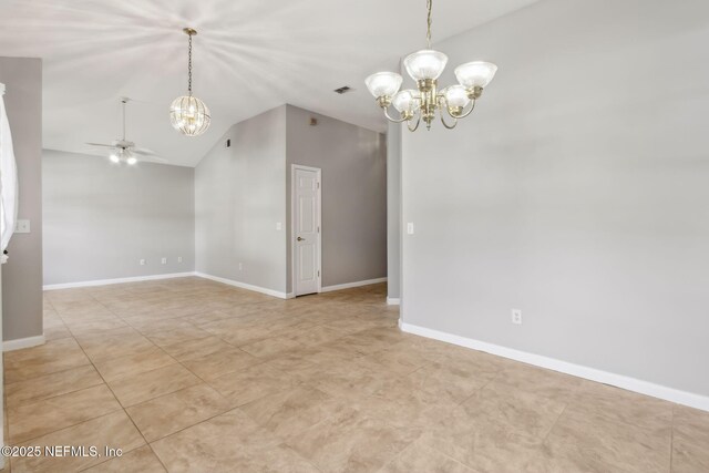 tiled spare room featuring lofted ceiling and ceiling fan with notable chandelier