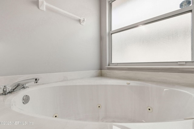 bathroom featuring a tub