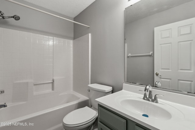 full bathroom featuring vanity, toilet, a textured ceiling, and shower / bath combination