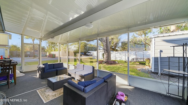 sunroom / solarium with lofted ceiling