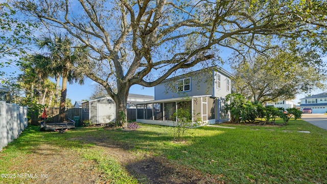 view of yard with a sunroom