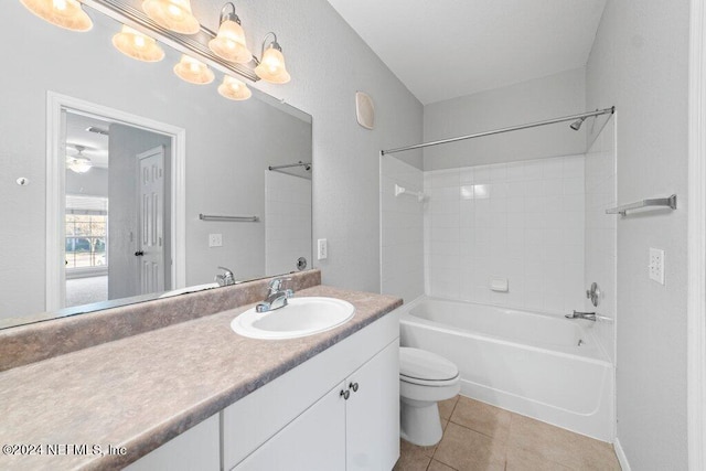 full bathroom featuring tile patterned flooring, vanity, bathtub / shower combination, and toilet