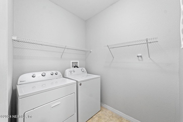 laundry room with separate washer and dryer