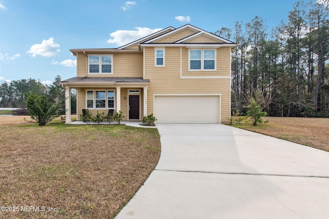 view of front of home with a porch, a front lawn, and a garage