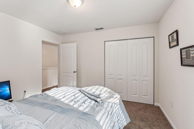 carpeted bedroom with a closet