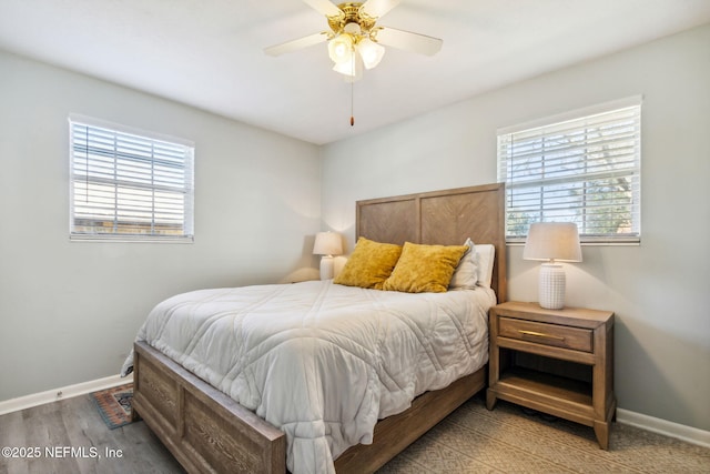 bedroom with hardwood / wood-style floors and ceiling fan