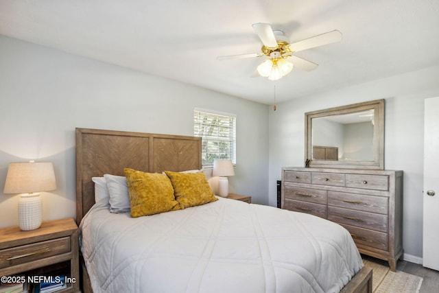 bedroom featuring ceiling fan and light hardwood / wood-style flooring