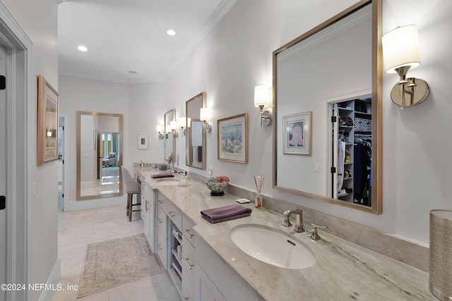 bathroom with vanity and ornamental molding