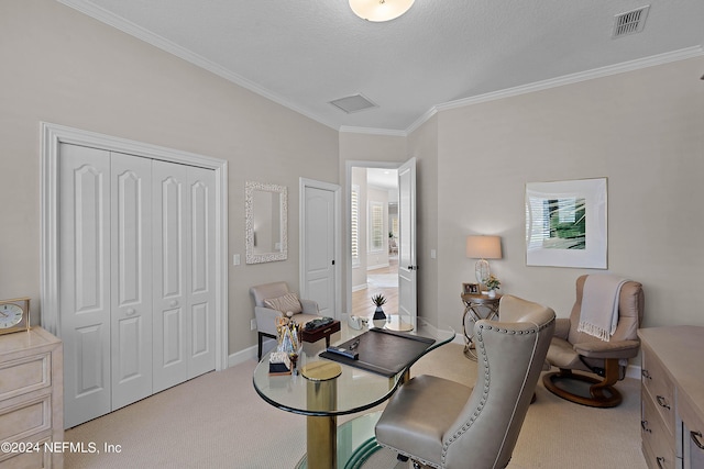 carpeted home office featuring crown molding