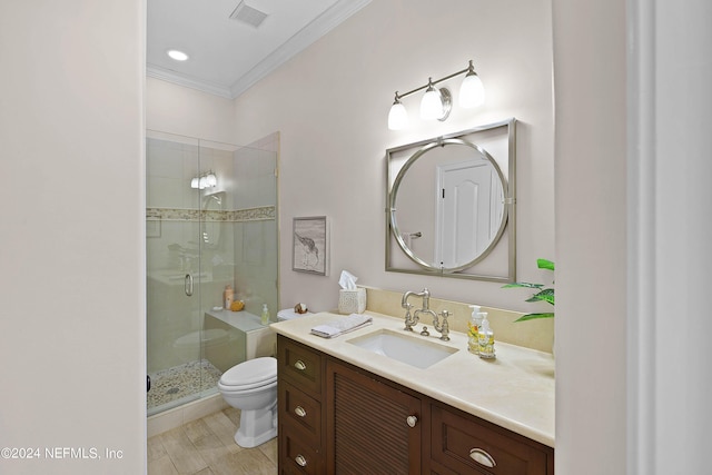 bathroom featuring toilet, vanity, crown molding, and walk in shower