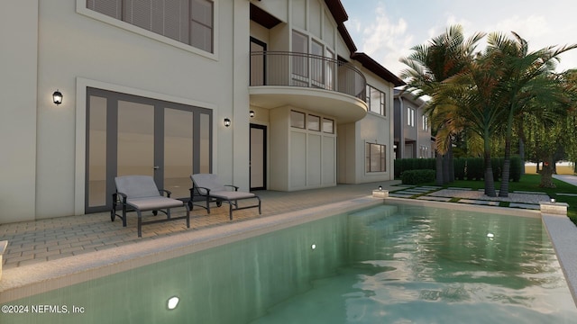 view of swimming pool with a patio