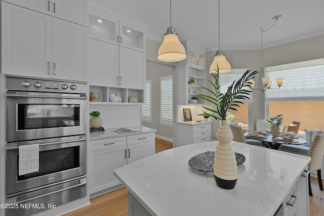 kitchen with double oven, light wood-type flooring, a warming drawer, and open shelves