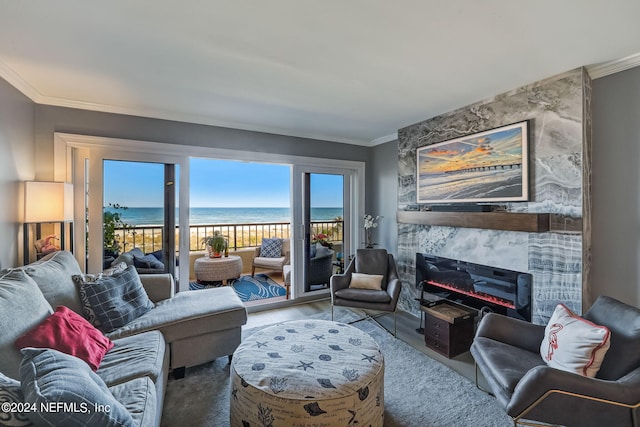 living room featuring a beach view, hardwood / wood-style floors, a water view, and crown molding