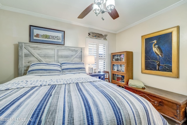 bedroom with ceiling fan and crown molding