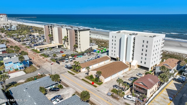 birds eye view of property featuring a water view and a view of the beach