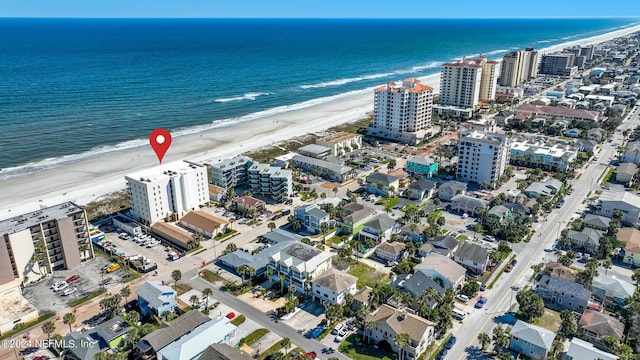 aerial view featuring a water view and a view of the beach