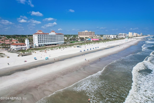 aerial view with a view of the beach and a water view