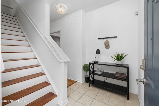 stairs with tile patterned floors