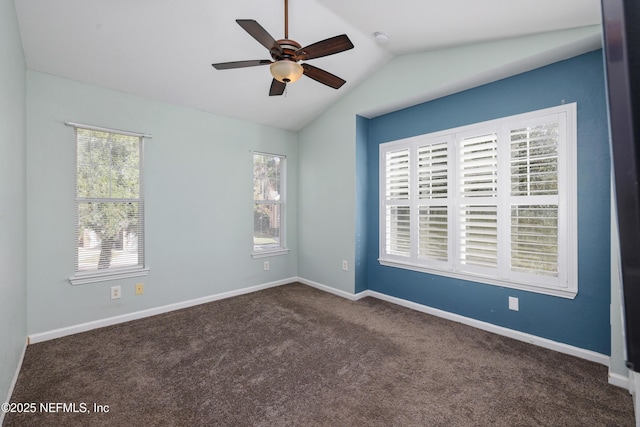 unfurnished room with ceiling fan, dark carpet, and vaulted ceiling