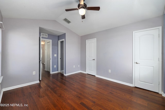 unfurnished bedroom featuring ceiling fan, dark wood-type flooring, and vaulted ceiling