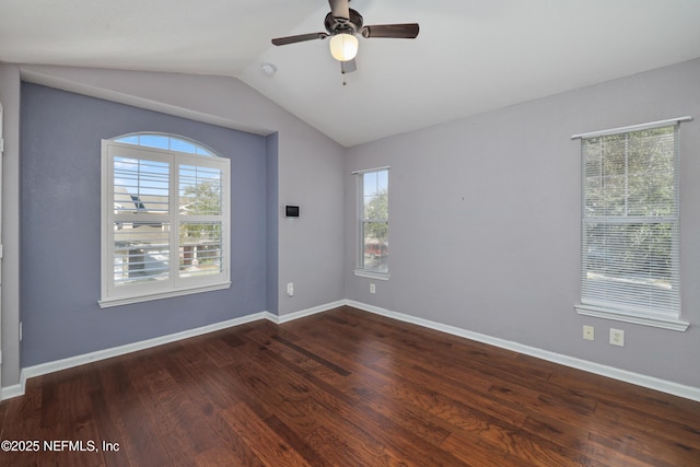 spare room featuring dark hardwood / wood-style floors, ceiling fan, and lofted ceiling