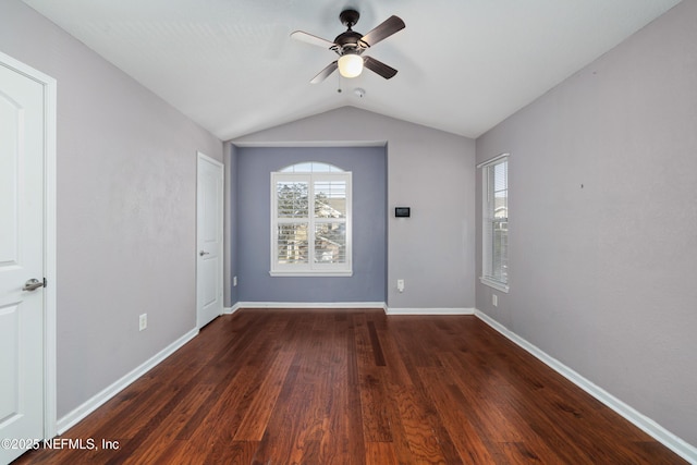 unfurnished room featuring ceiling fan, lofted ceiling, and dark wood-type flooring