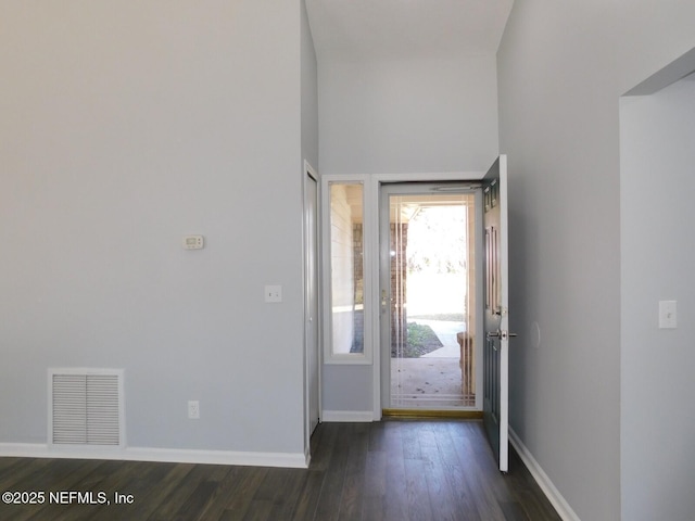 doorway to outside with dark wood-type flooring