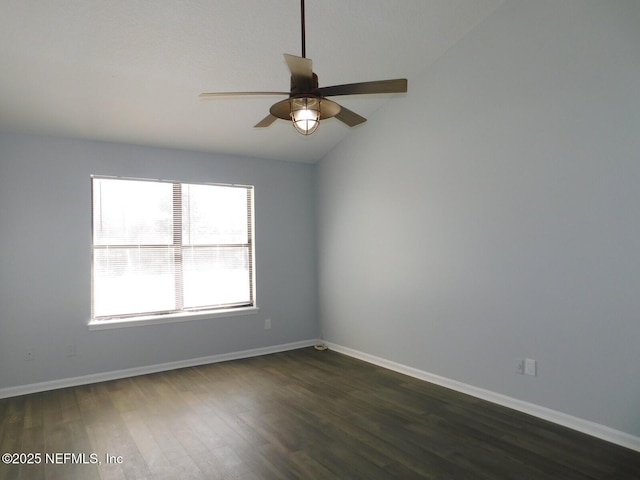 spare room featuring ceiling fan, dark hardwood / wood-style floors, and lofted ceiling