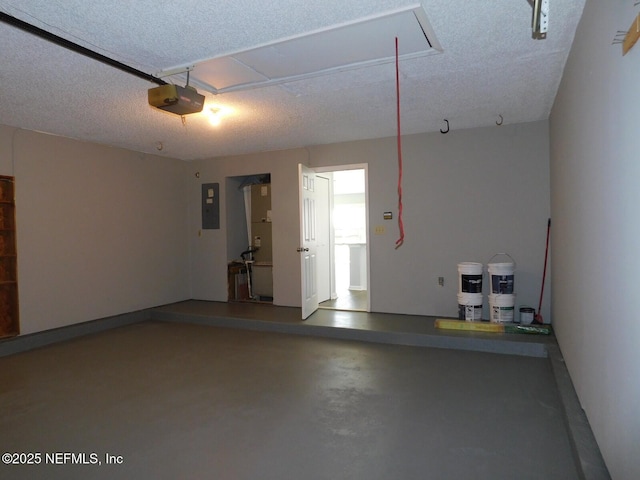 garage featuring electric panel and a garage door opener