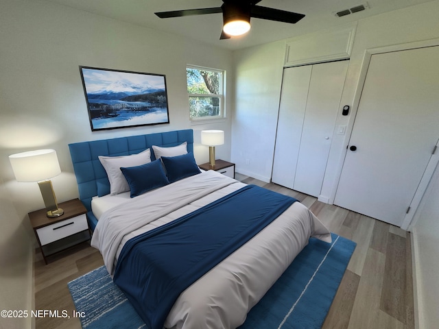 bedroom with ceiling fan and light hardwood / wood-style flooring